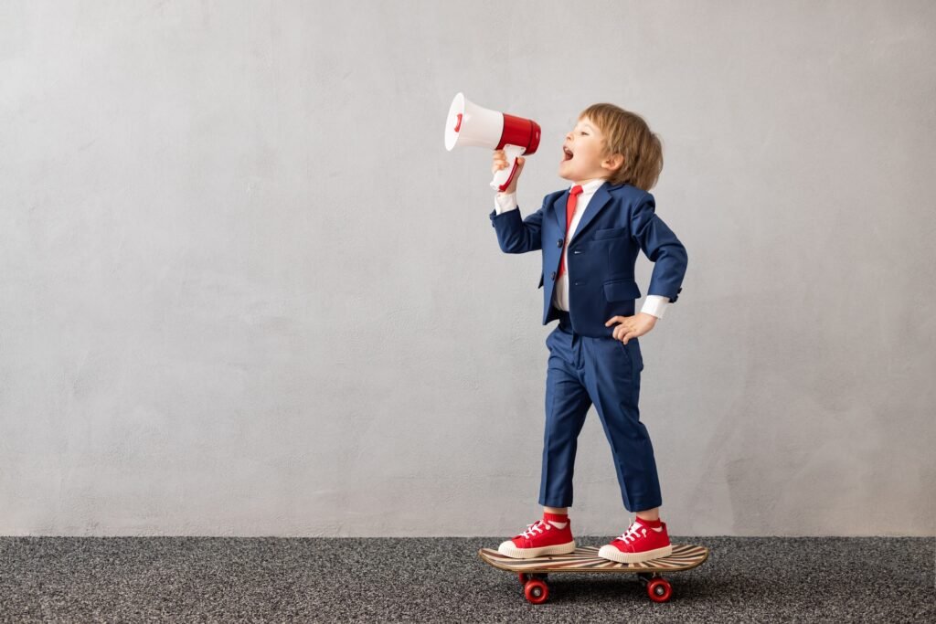 Happy child wearing suit riding vintage skateboard Happy child wearing suit riding vintage skateboard